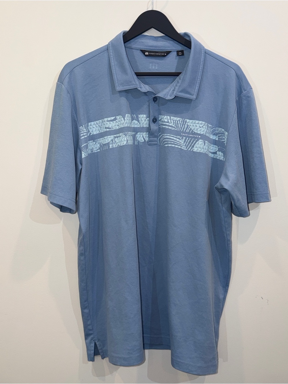 Travis Mathew Light Blue Polo with Chest Print